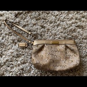 COACH gold wristlet